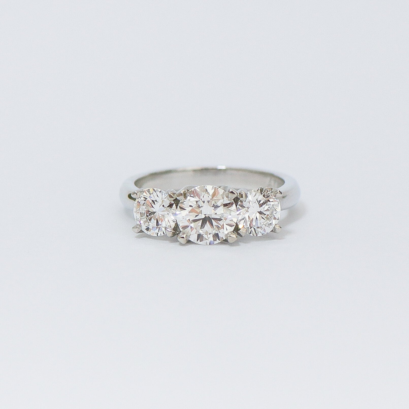 Charm 3 stone diamond engagement ring.