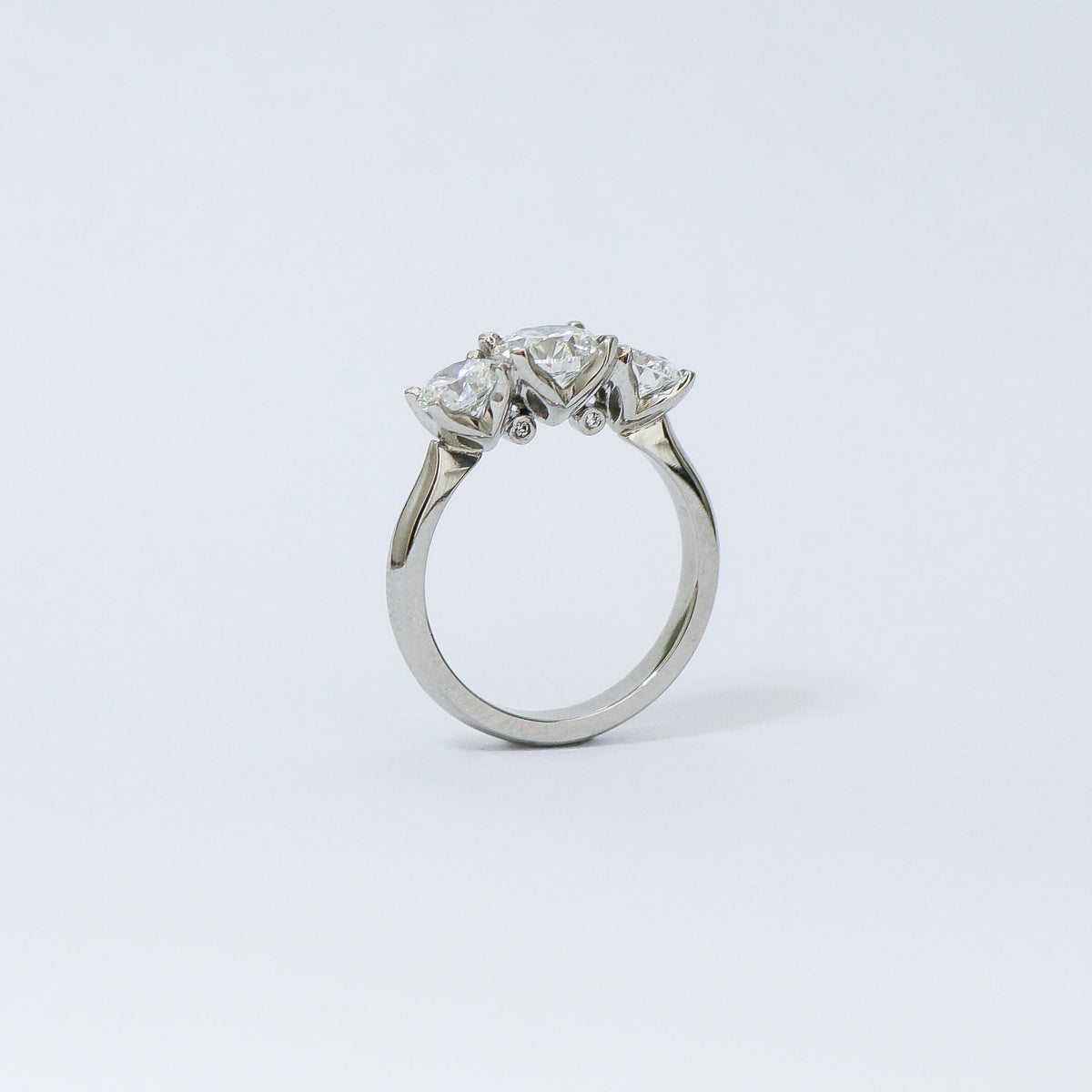 Charm 3 stone diamond ring.