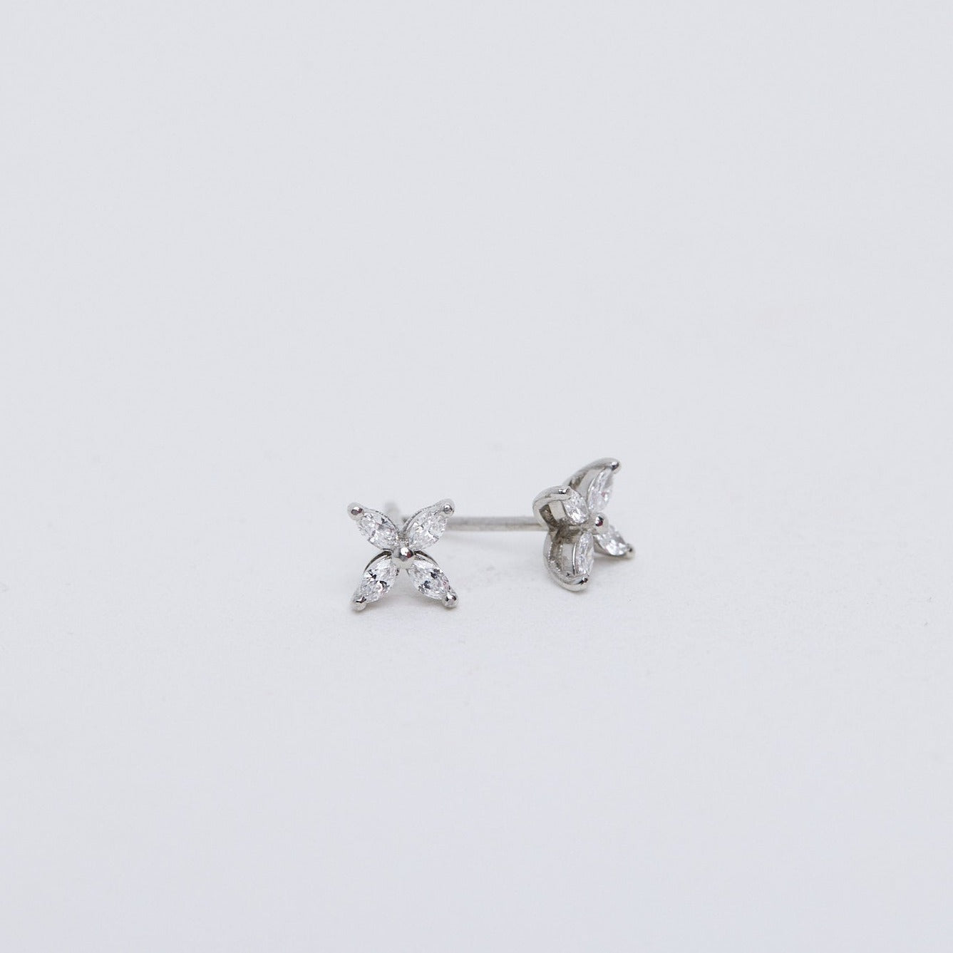 Small diamond flower stud earrings.