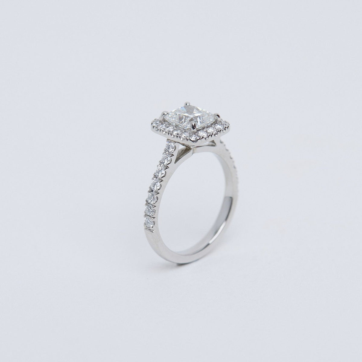 Cushion diamond halo ring.