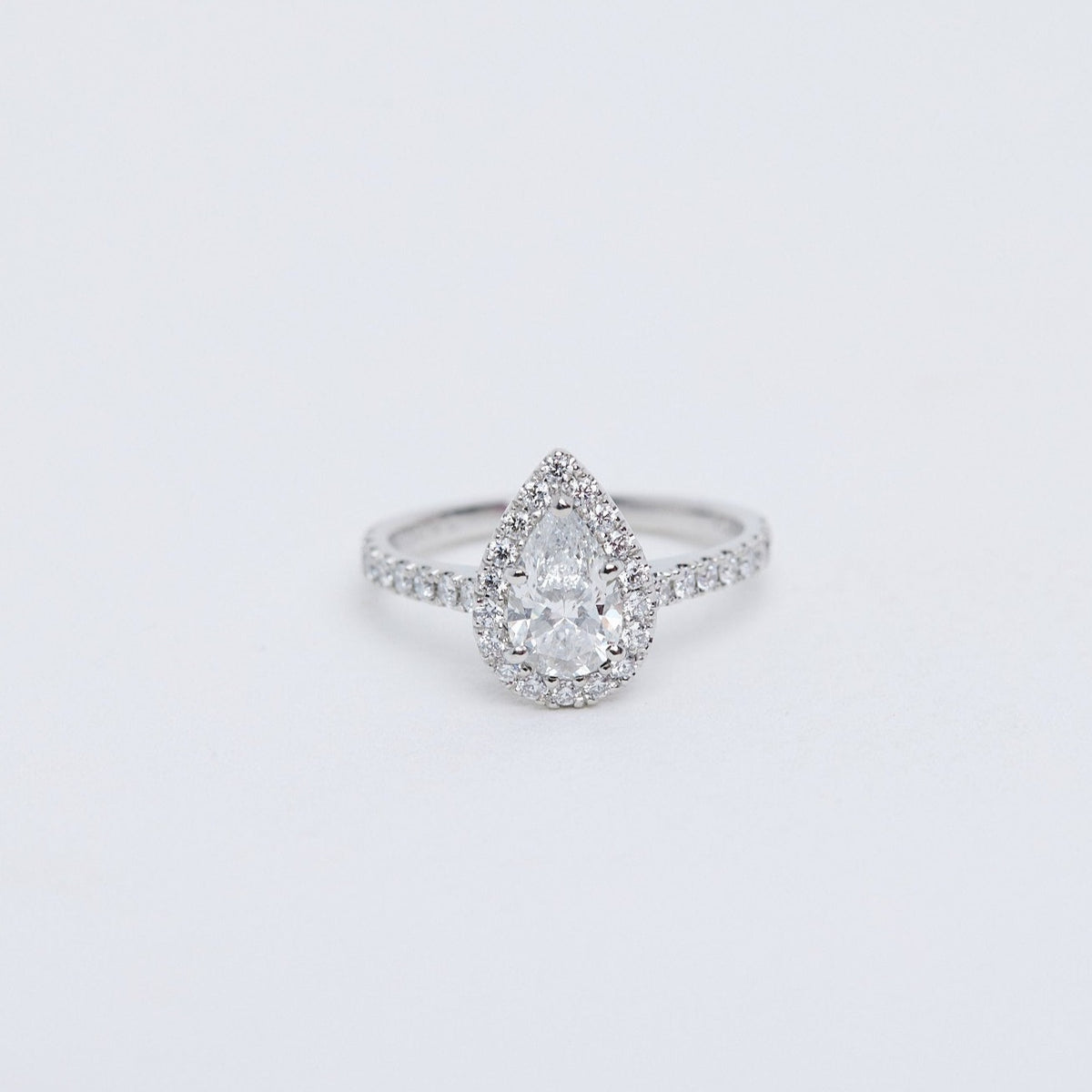 Pear diamond halo ring in platinum in auckland studio
