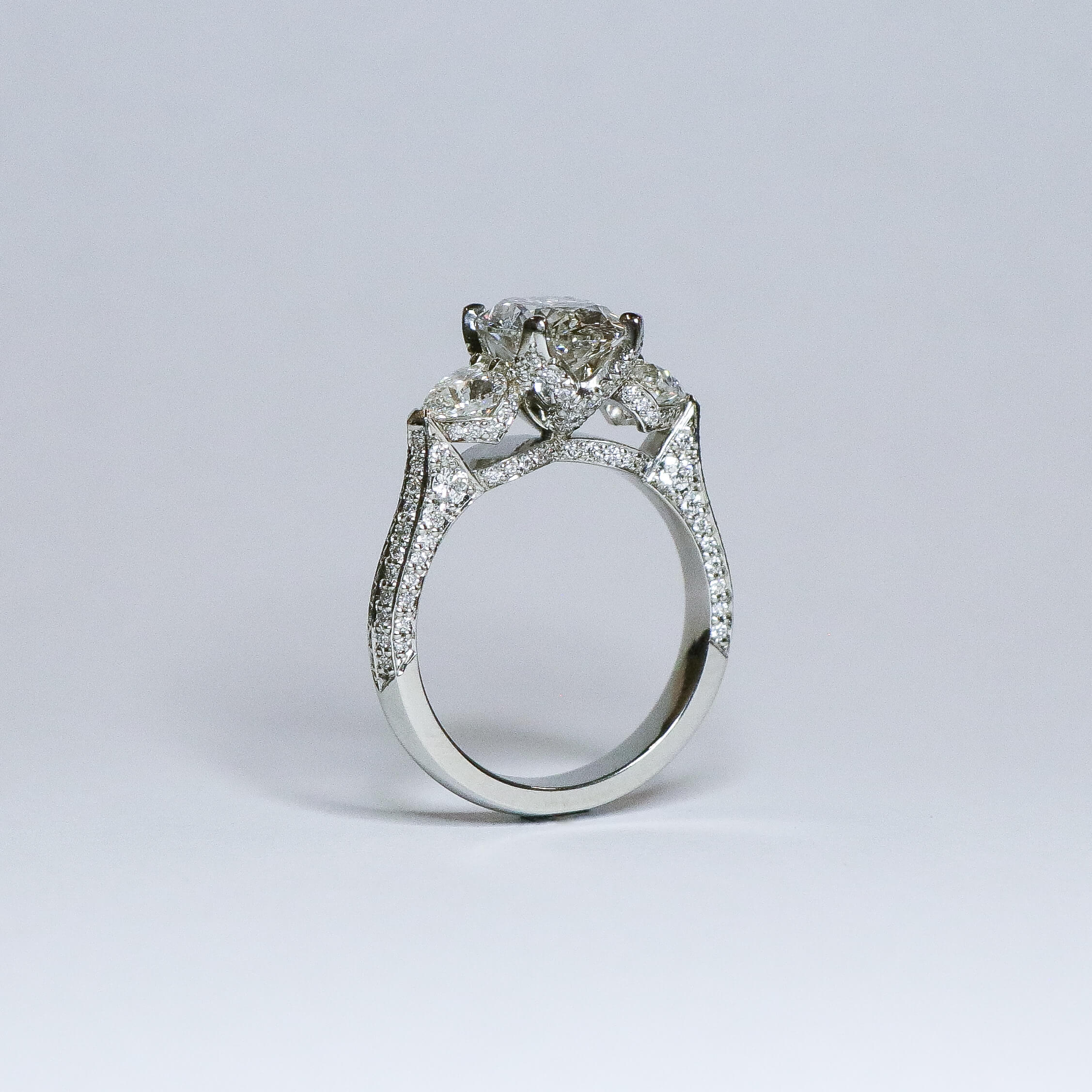 Oval diamond ring with fine diamond detailing