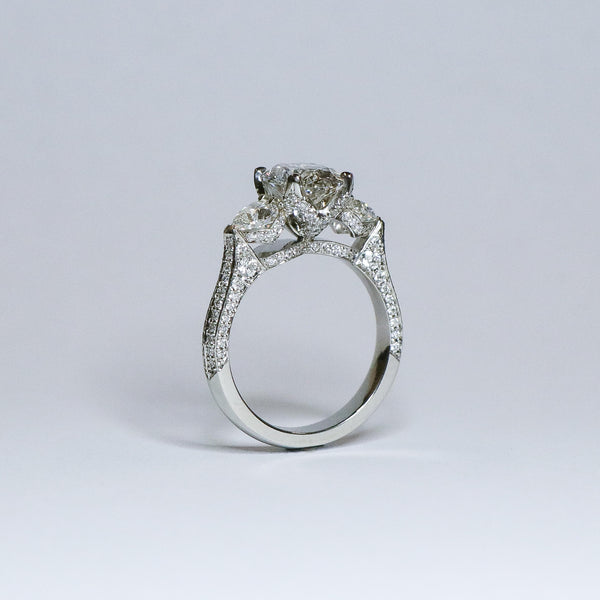 Oval diamond ring with fine diamond detailing