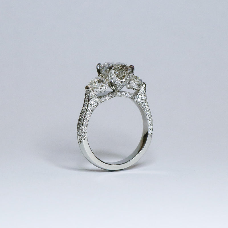 Oval diamond ring with fine diamond detailing