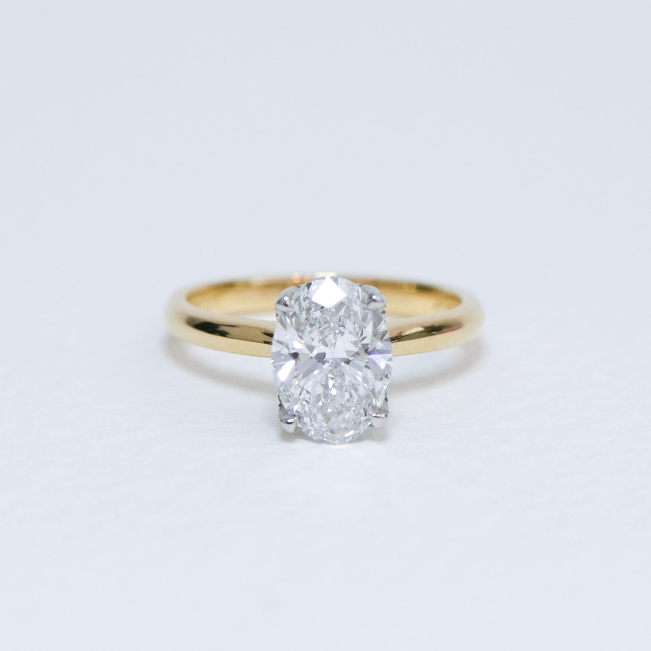 Oval Fleur Solitaire engagement ring