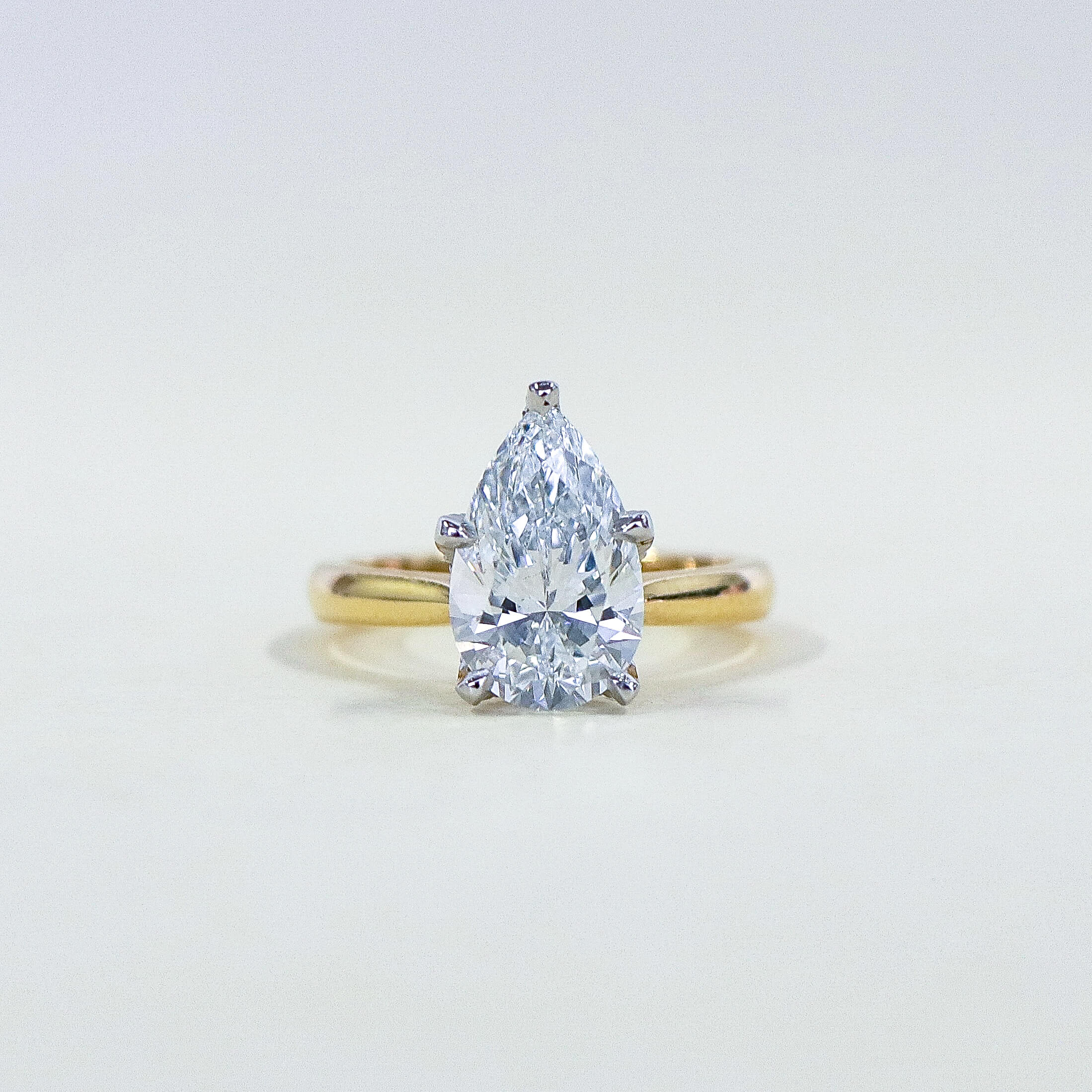 Pear cut Fleur solitaire engagement ring