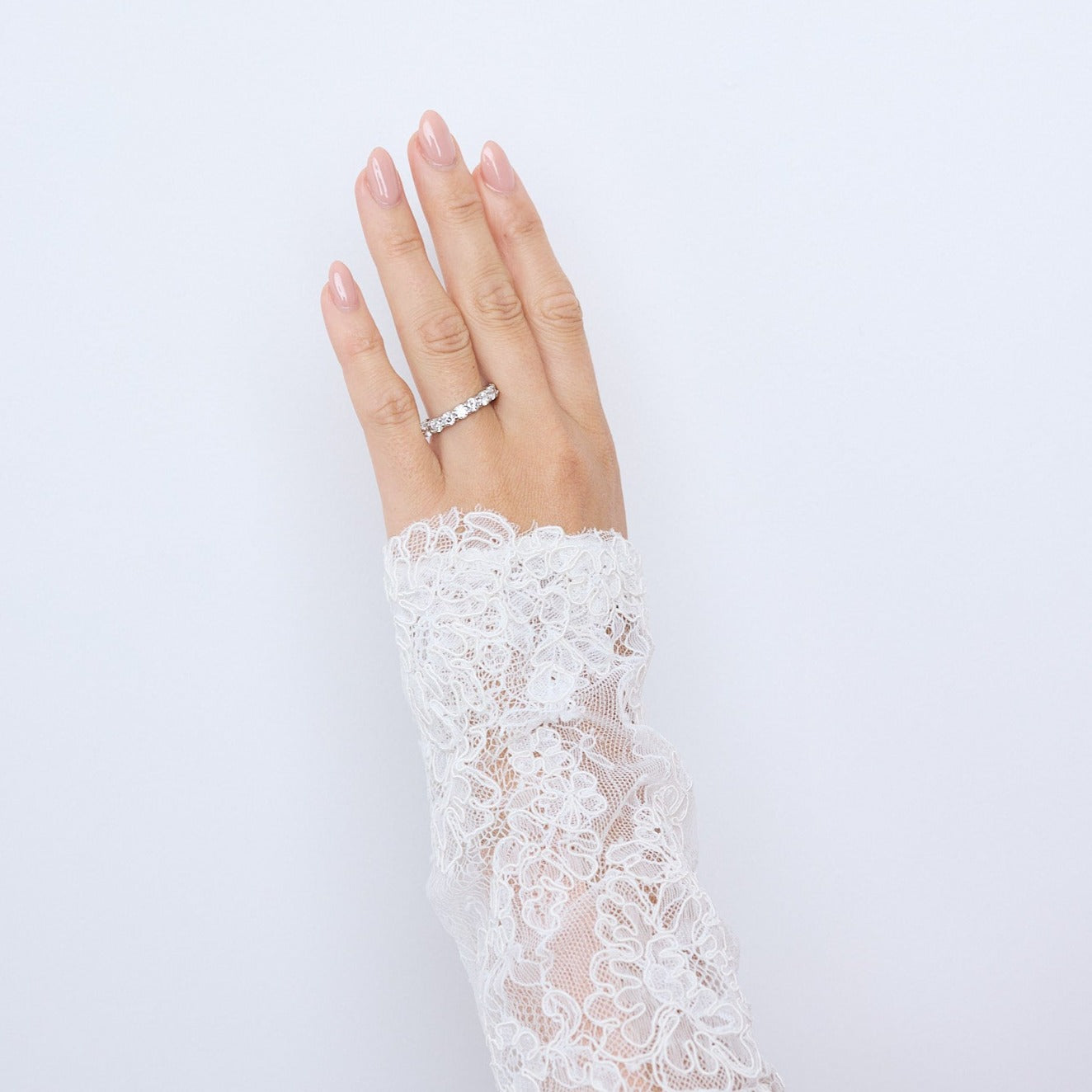 Round brilliant diamonds in a double bezel, platinum eternity ring. On hand.