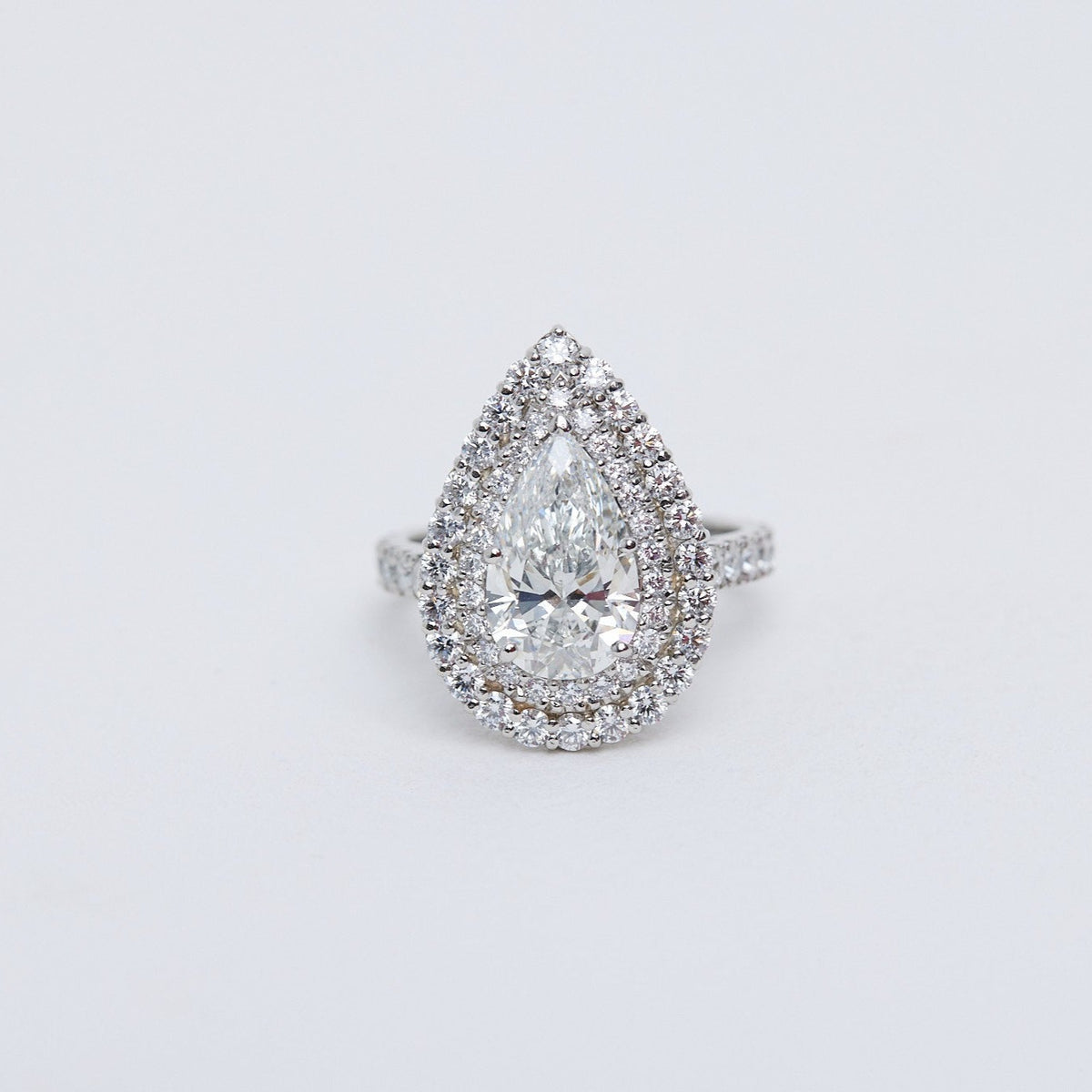 Pear diamond double halo diamond engagement ring.
